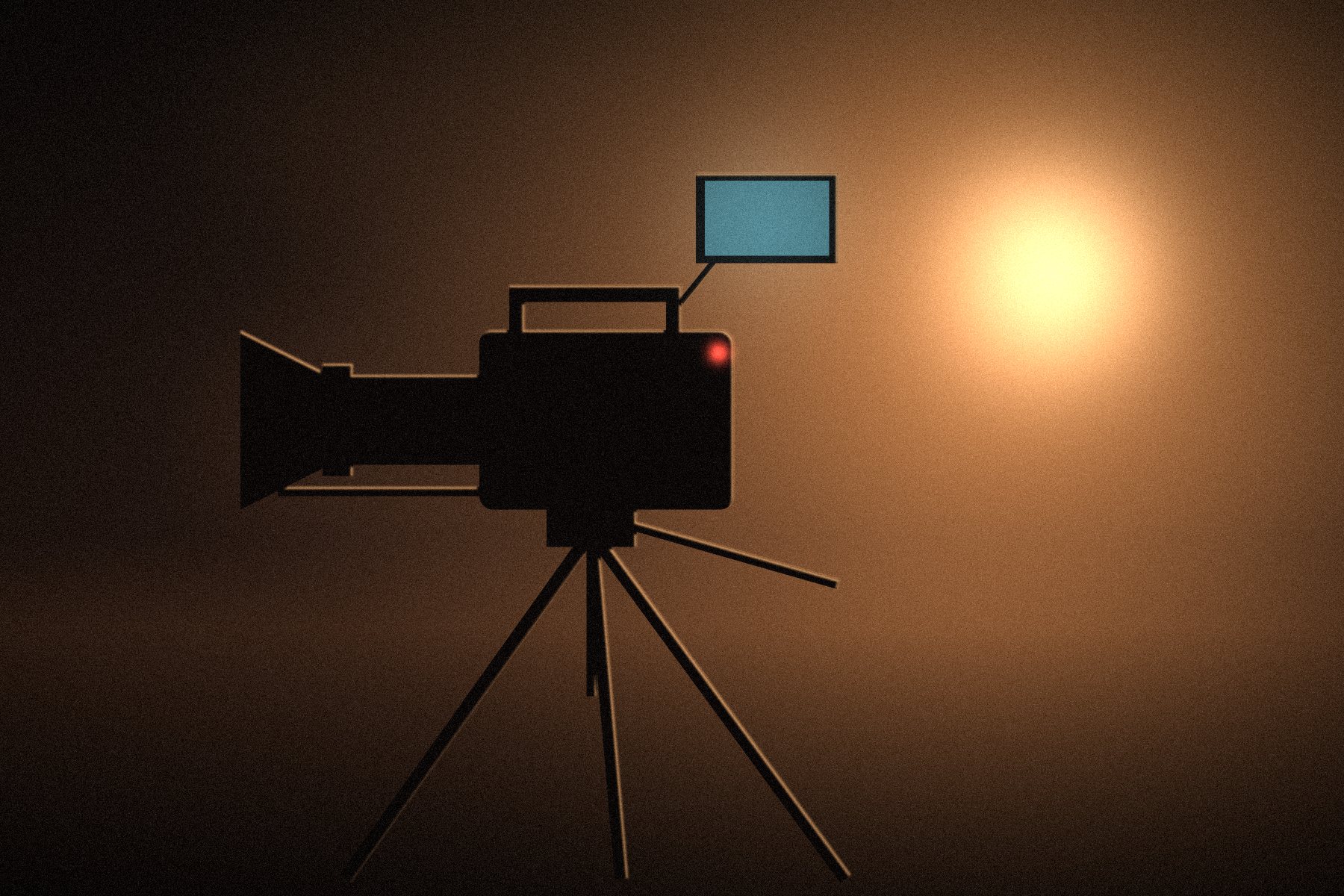 Cinema camera on a tripod, backlit by warm light
